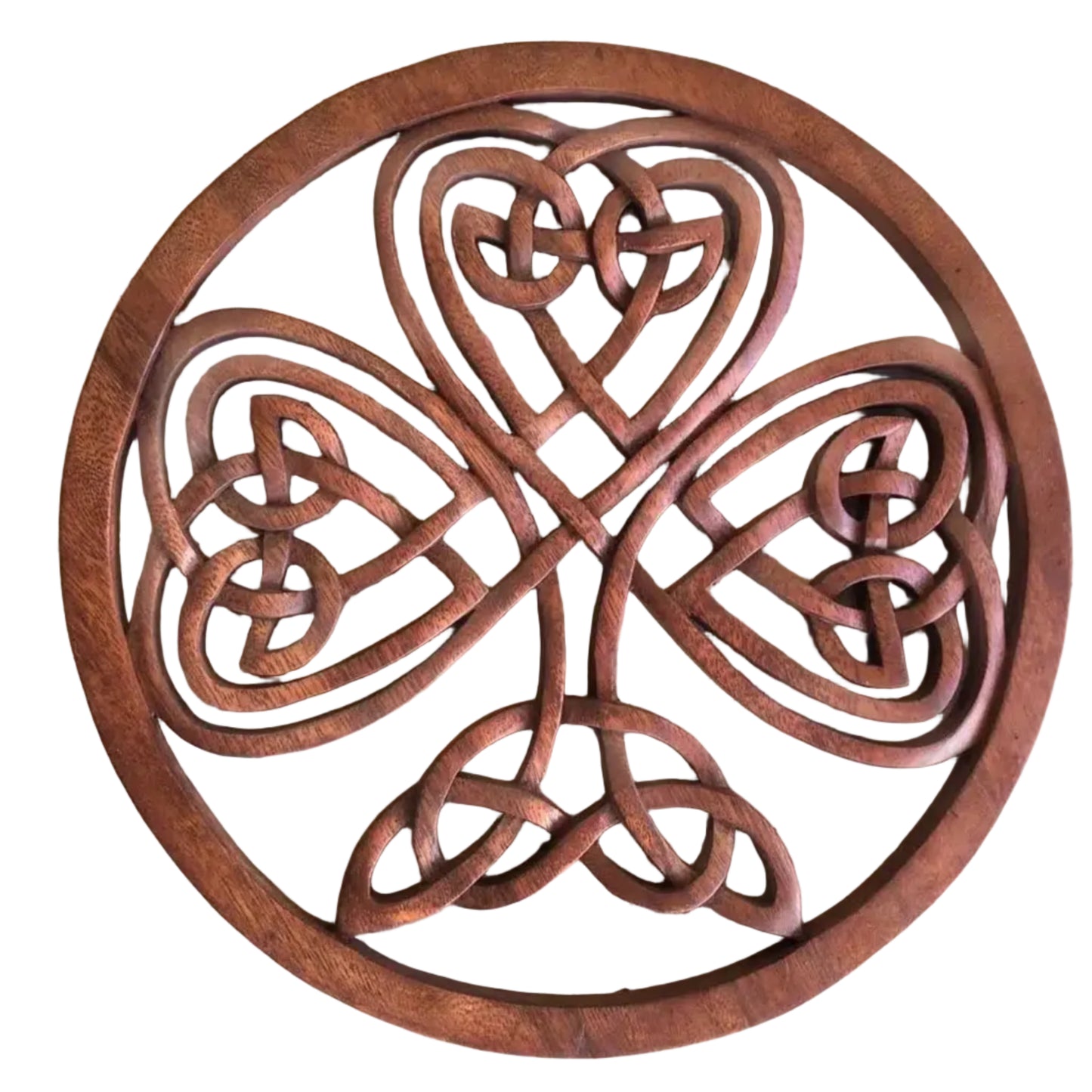 A wooden carving of a three-leaf shamrock with Celtic knots.