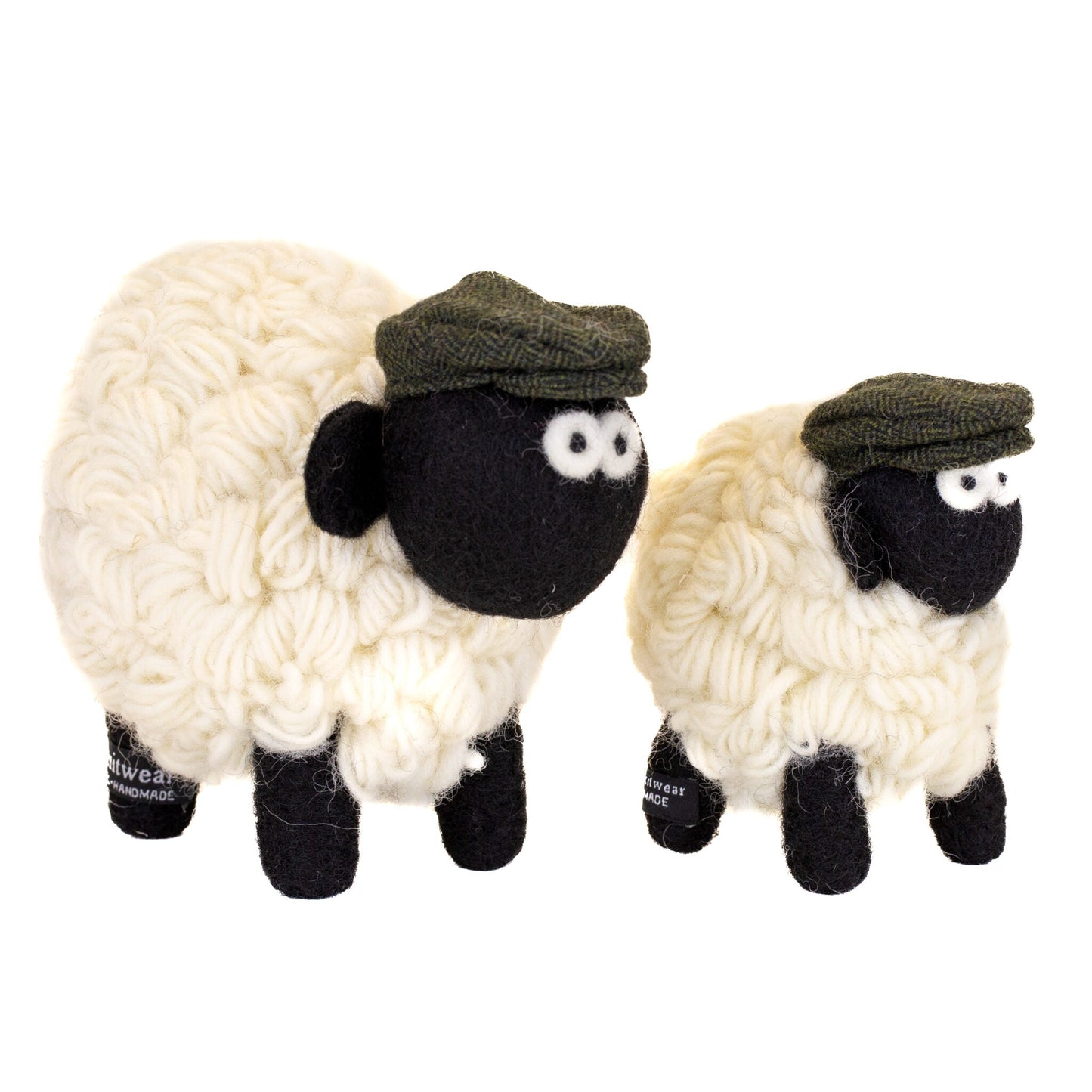 Two knitted wool sheep with flat caps. One medium and one large.