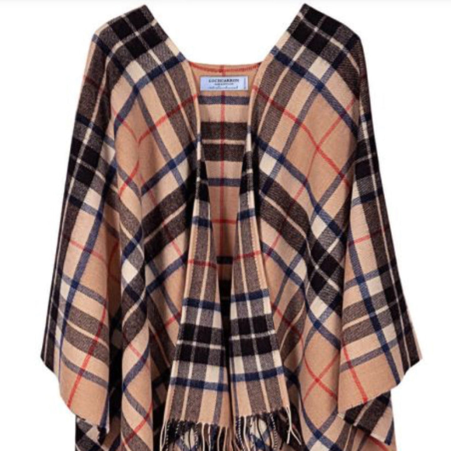 Plaid poncho with fringes on a white background