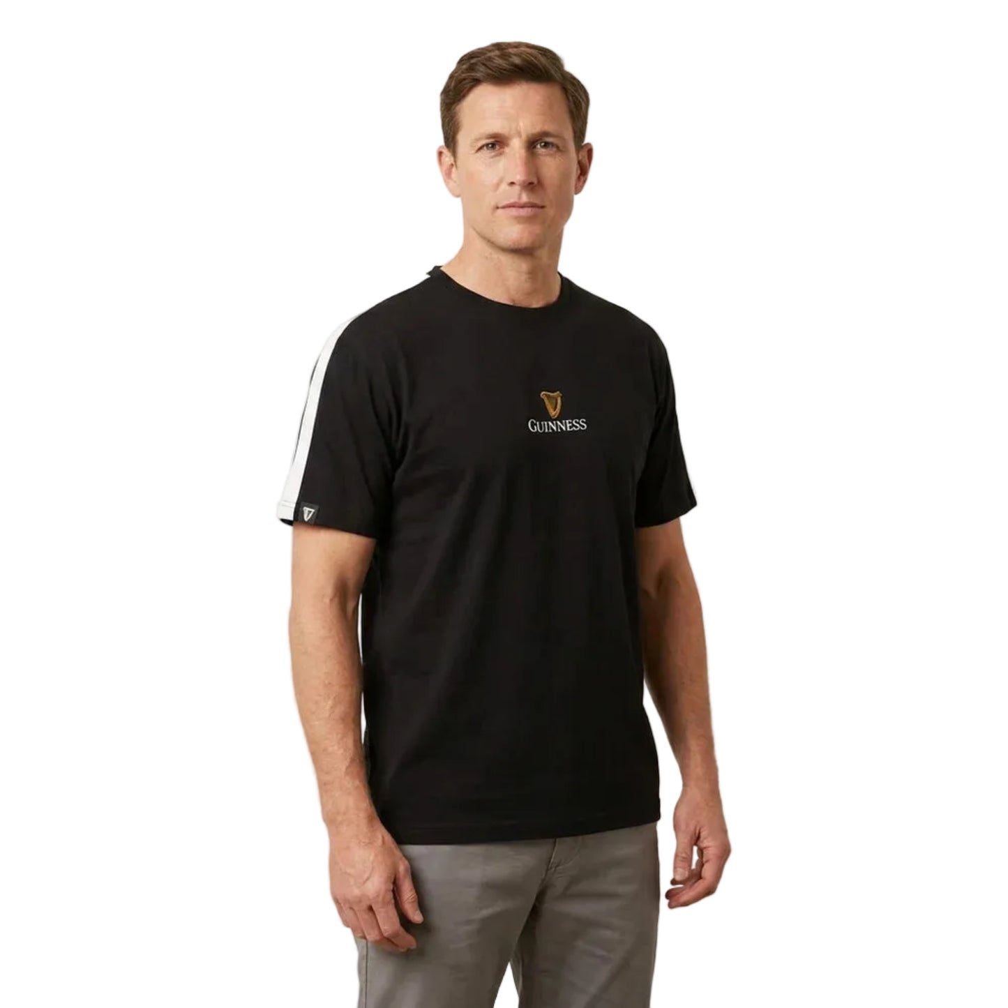 Man wearing a black shirt that says "Guinness" on the front in small lettering with a harp logo above it.