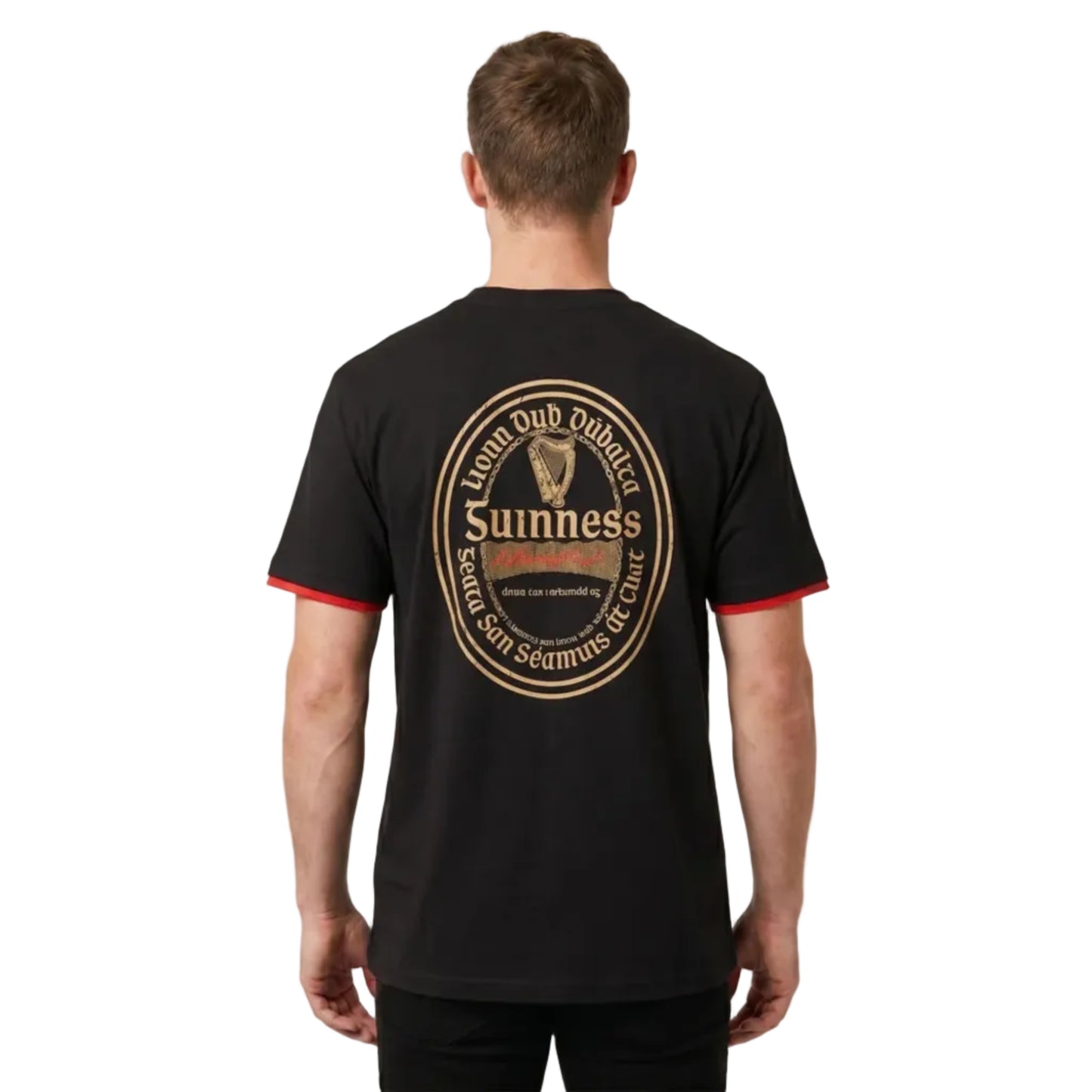 Man turned to show the back of his shirt. It has a large Guinness beer label written in Gaelic.