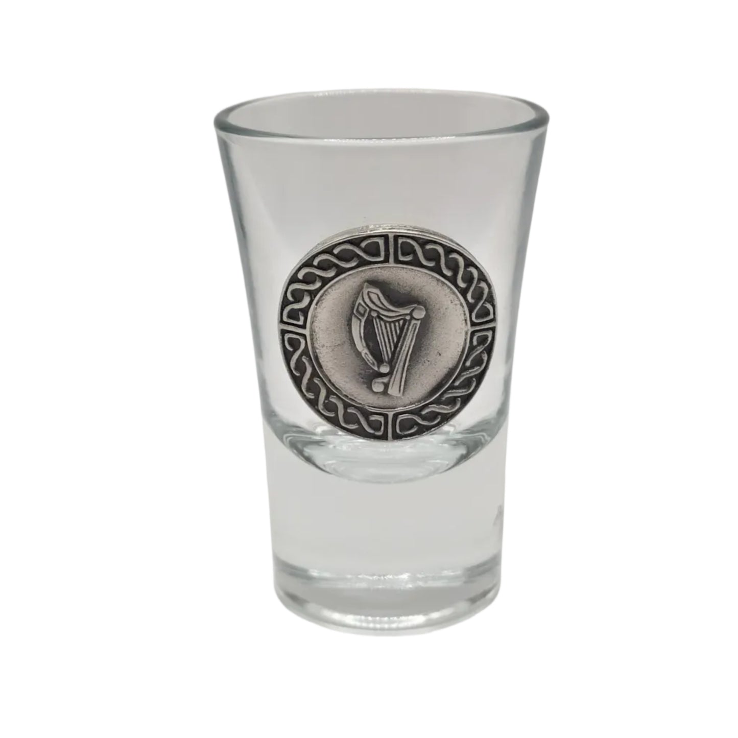 Clear shot glass with a pewter harp emblem with a celtic knotwork border