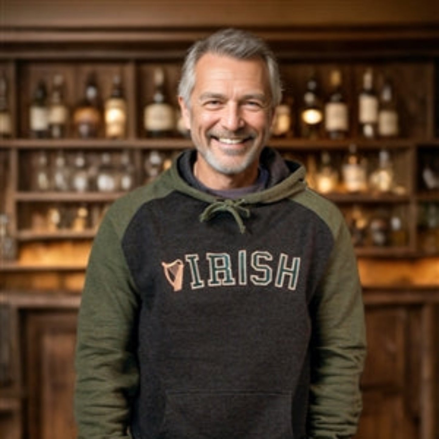 Man wearing a hoodie with 'Irish' text in a bar setting