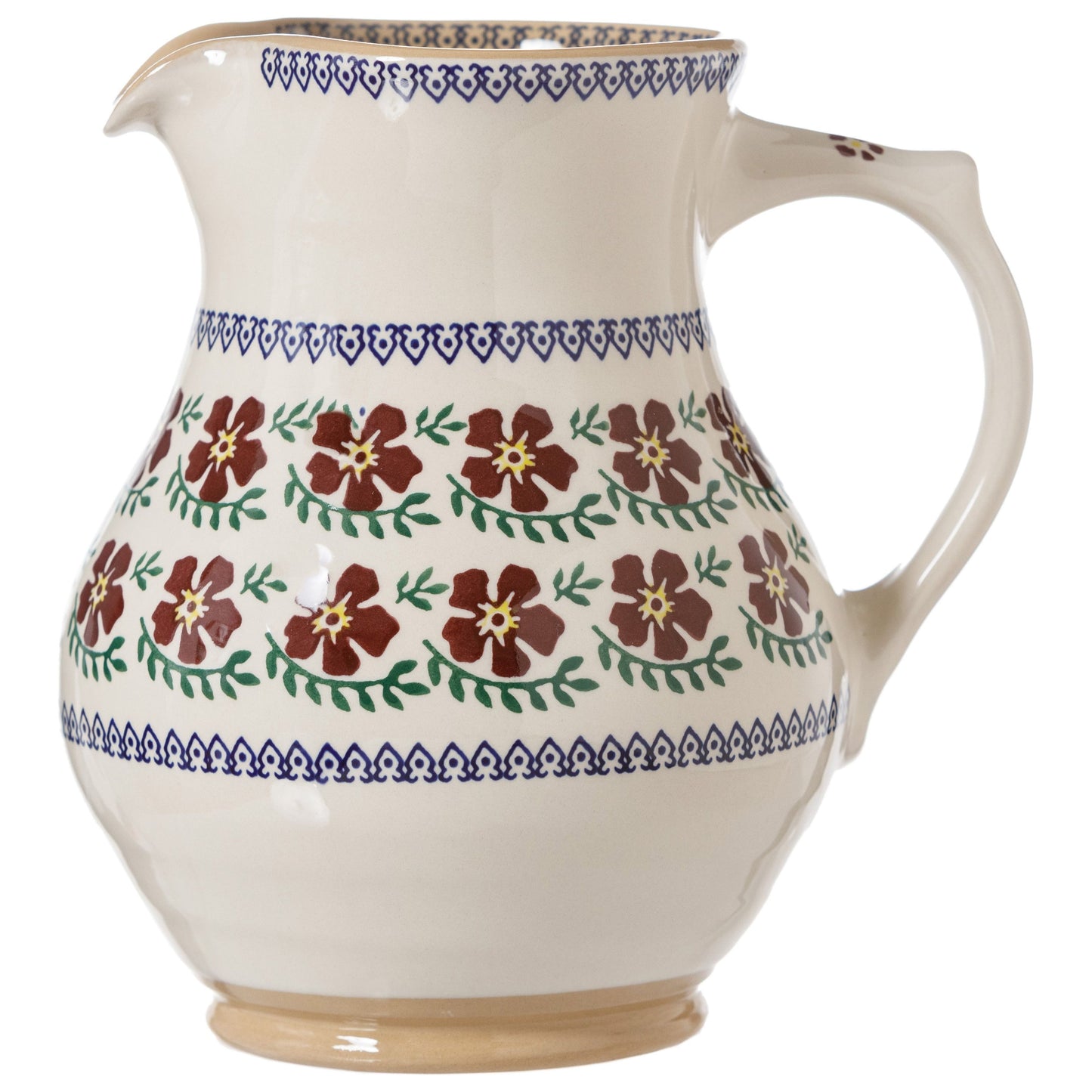 A large ceramic jug with a red floral pattern. Blue geometric trim pattern.
