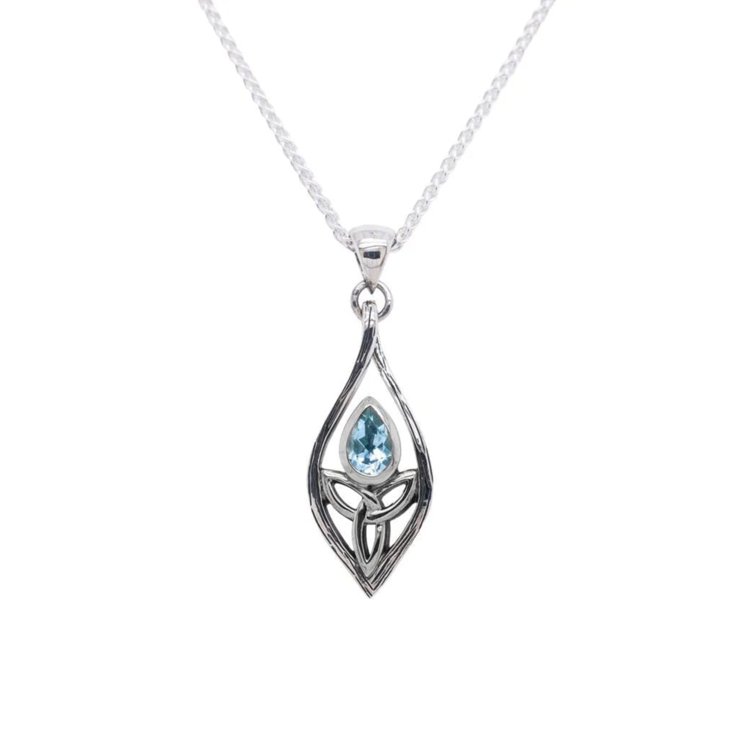 Silver pendant with a blue gemstone on a white background