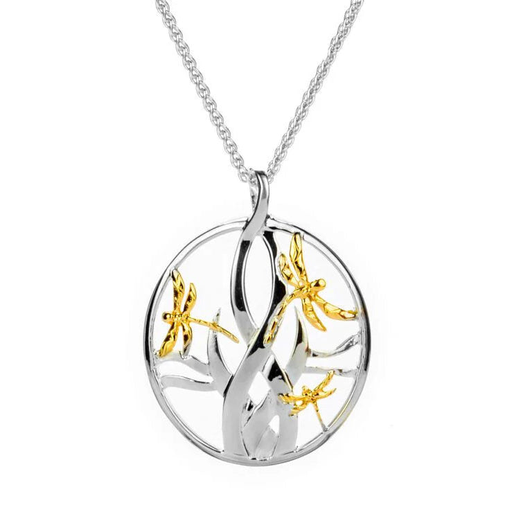 A sterling silver pendant with a 10k yellow gold dragonfly design, attached to a chain.