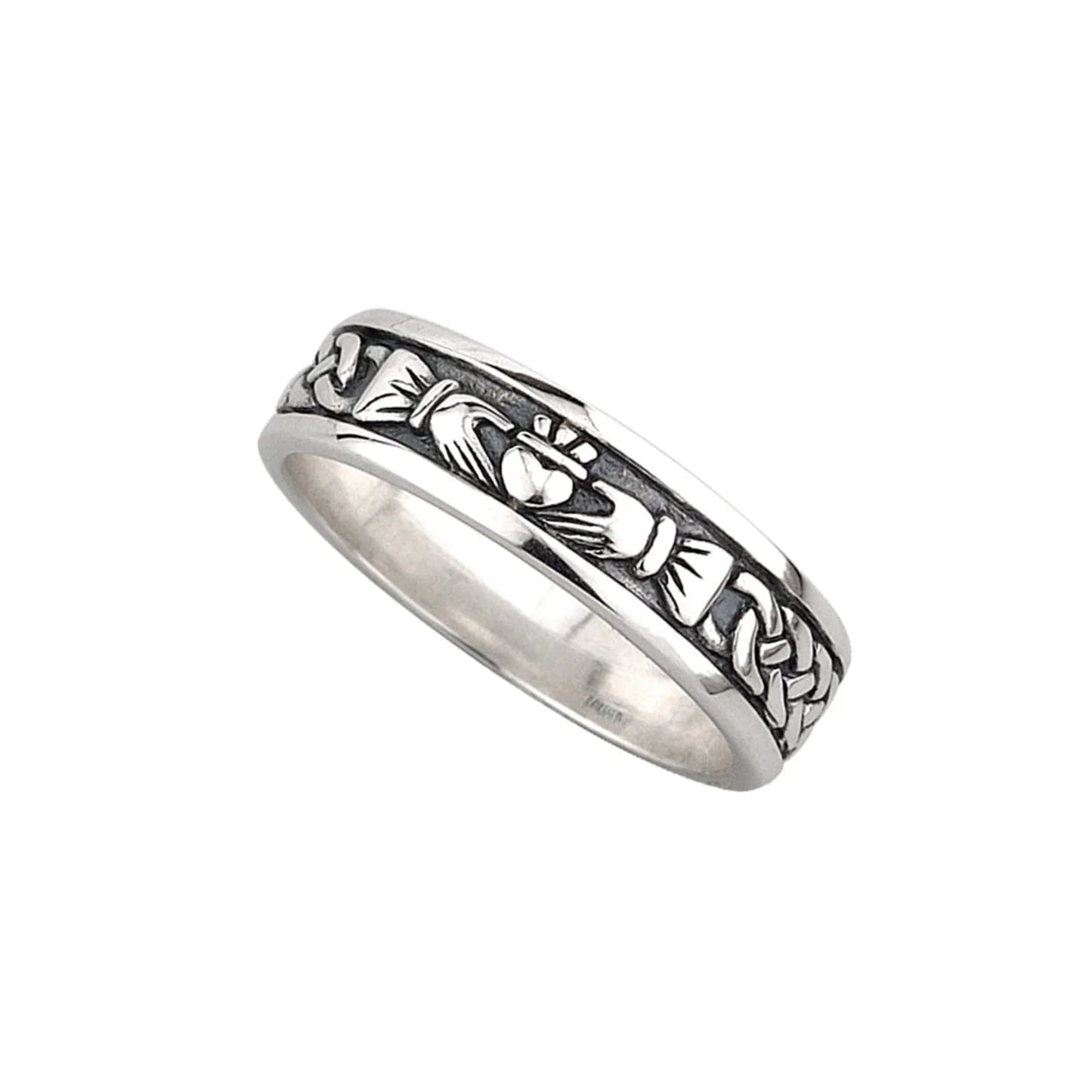 A sterling silver Claddagh band ring with a deep-set oxidized middle. The raised silver design on top is traditional claddagh artwork with a weaved sleeve design.