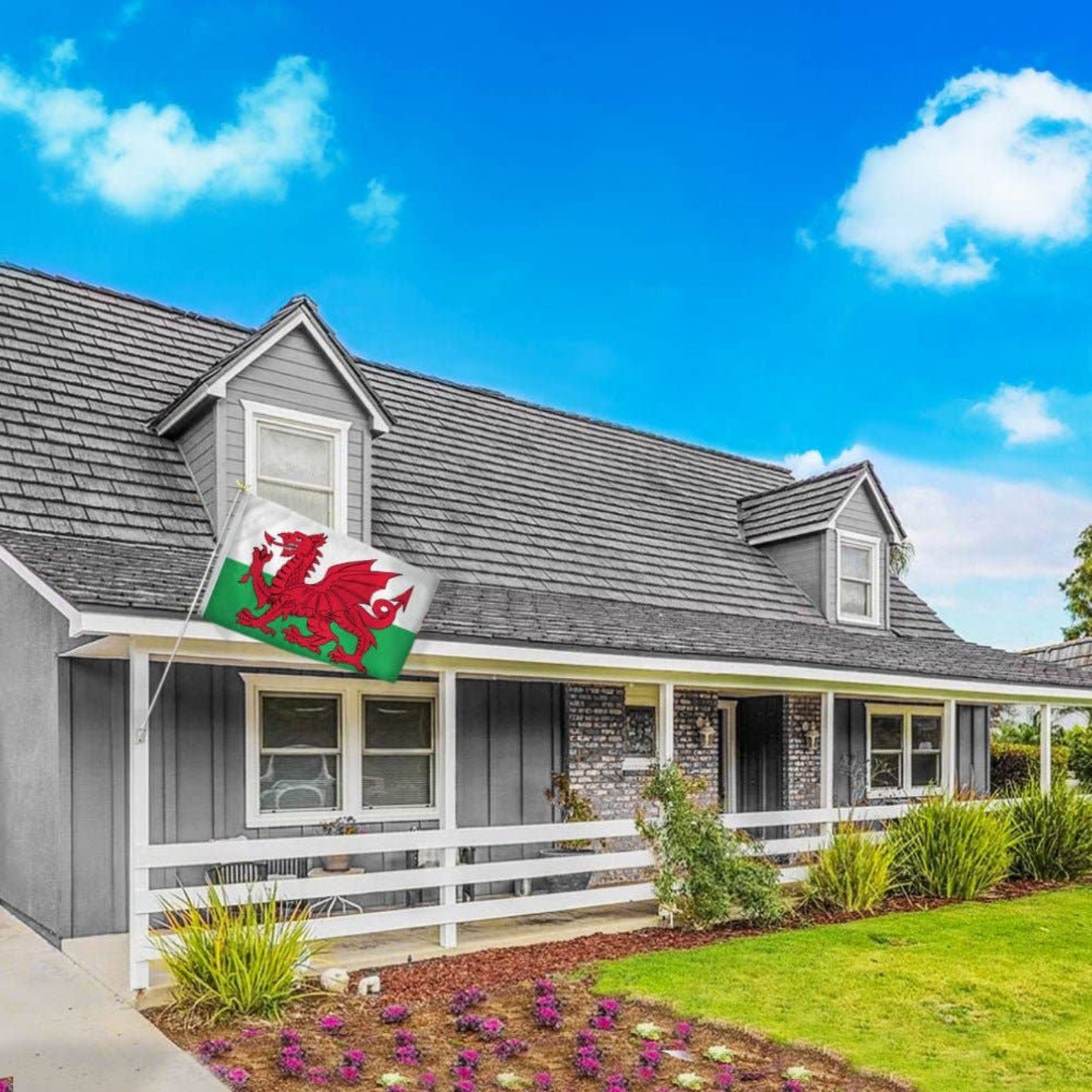 House with a Welsh flag flying on the porch.
