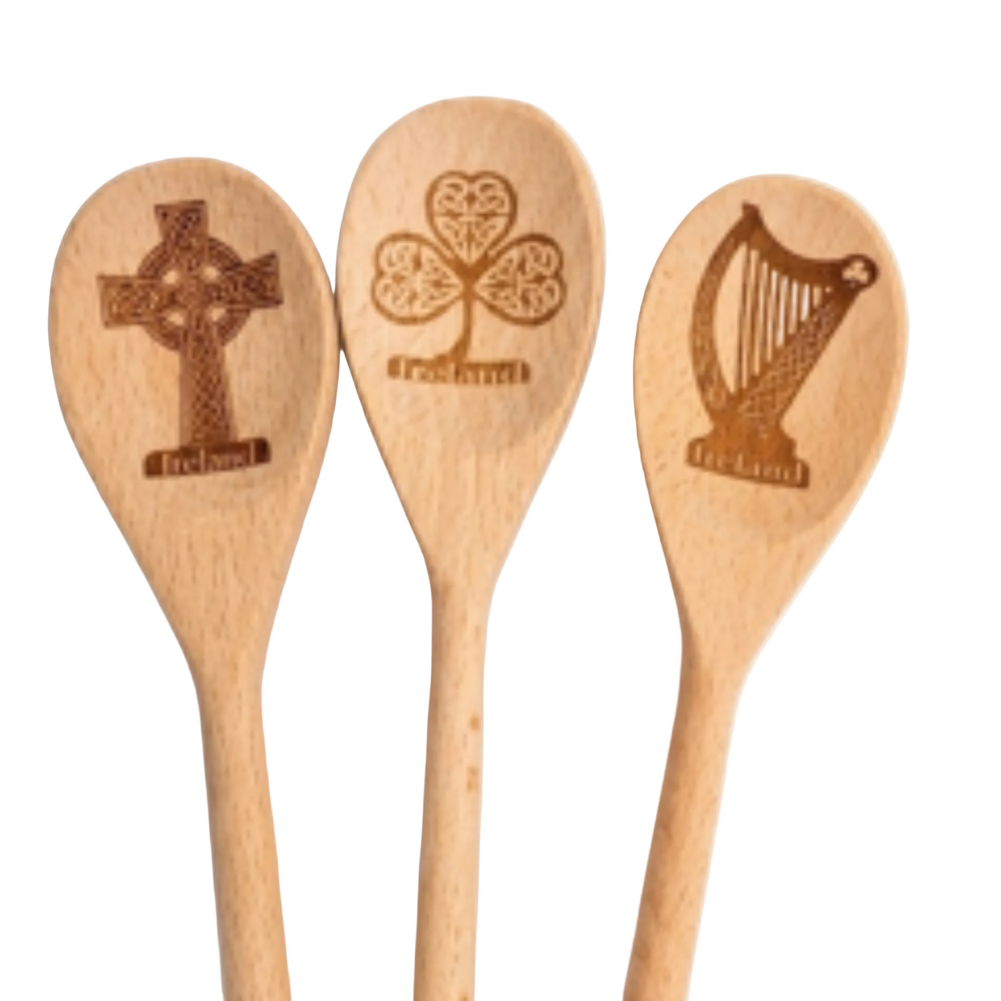 Three wooden spoons with Celtic designs on a white background