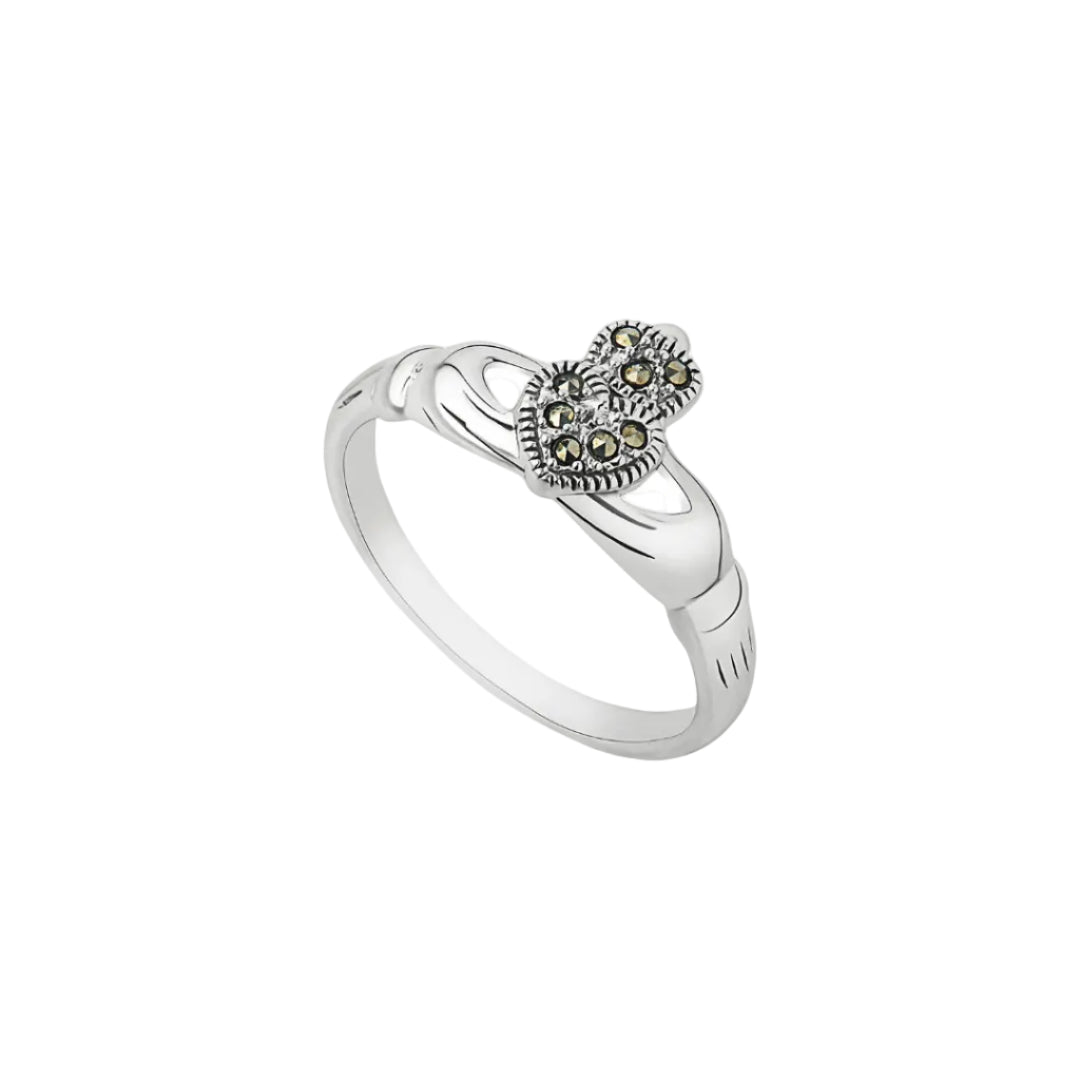 Silver ring with heart-shaped gemstone on a white background