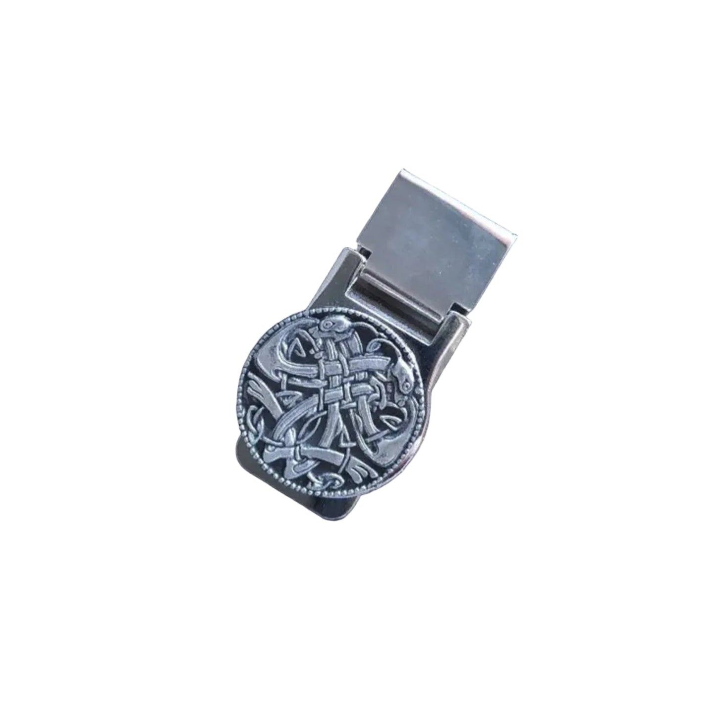 A silver-colored money clip with a celtic design.
