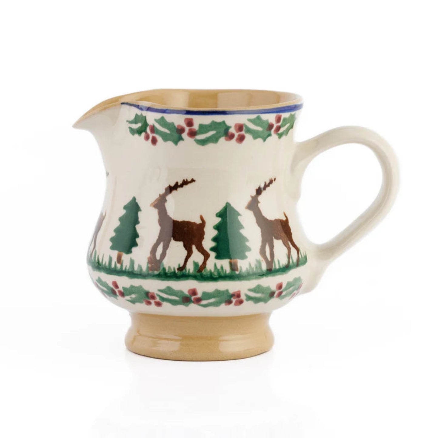 Decorative ceramic pitcher with deer and holly design on a white background