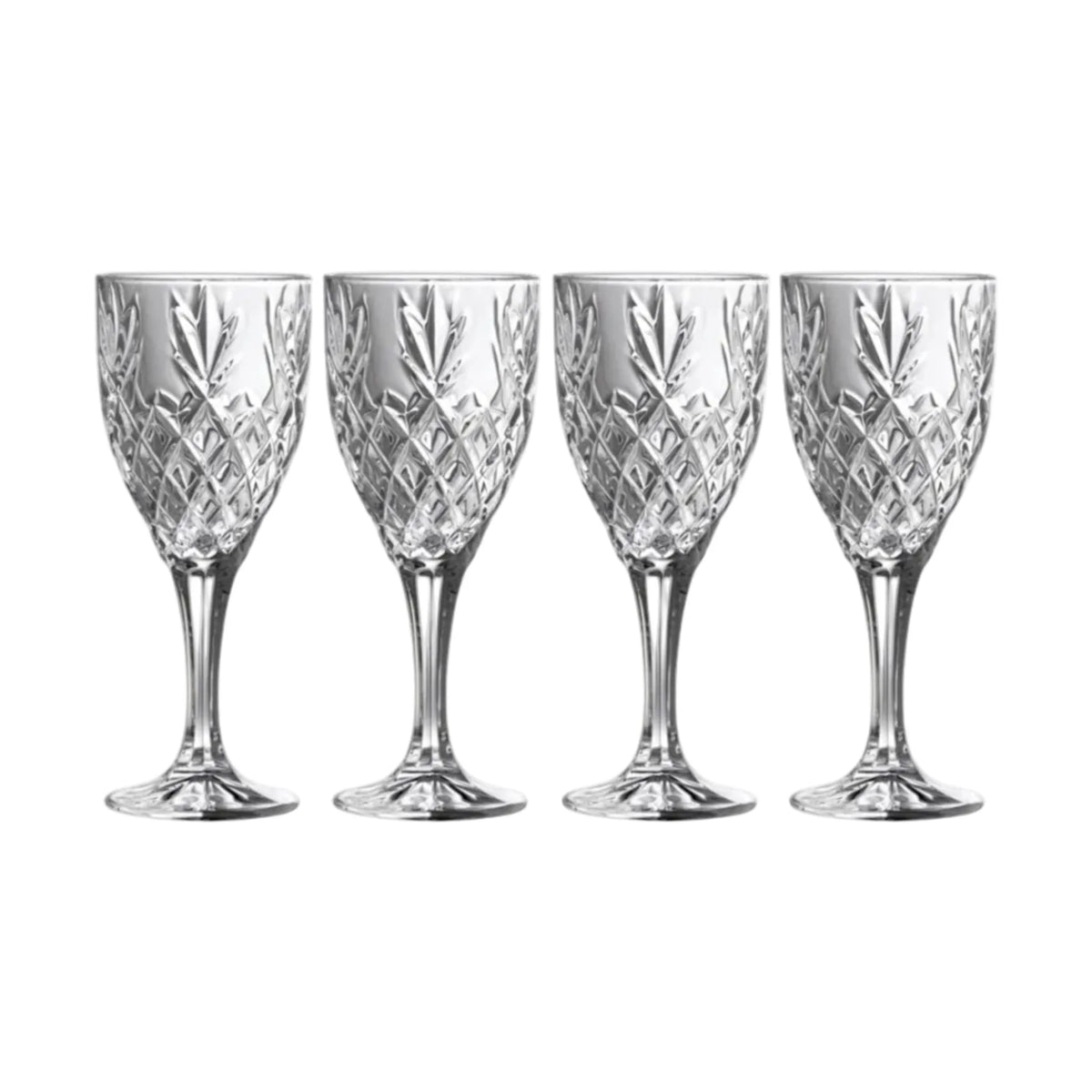 Four crystal wine glasses with cut patterns on a white background