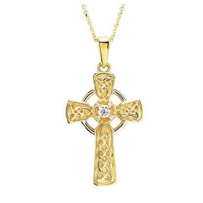 Gold Celtic cross pendant with trinity knot detailing and a diamond center.