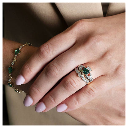 Close-up of a hand wearing the wavy diamond band and a complementary claddagh.