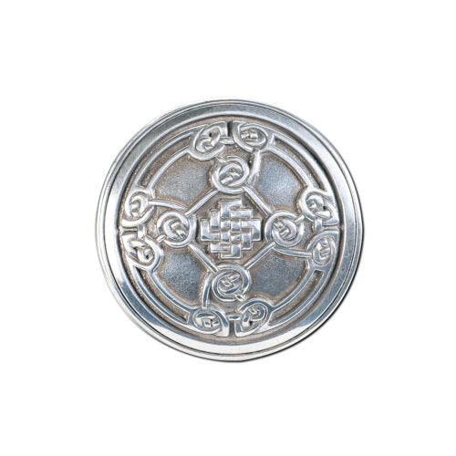 Silver emblem with intricate Celtic design on a white background