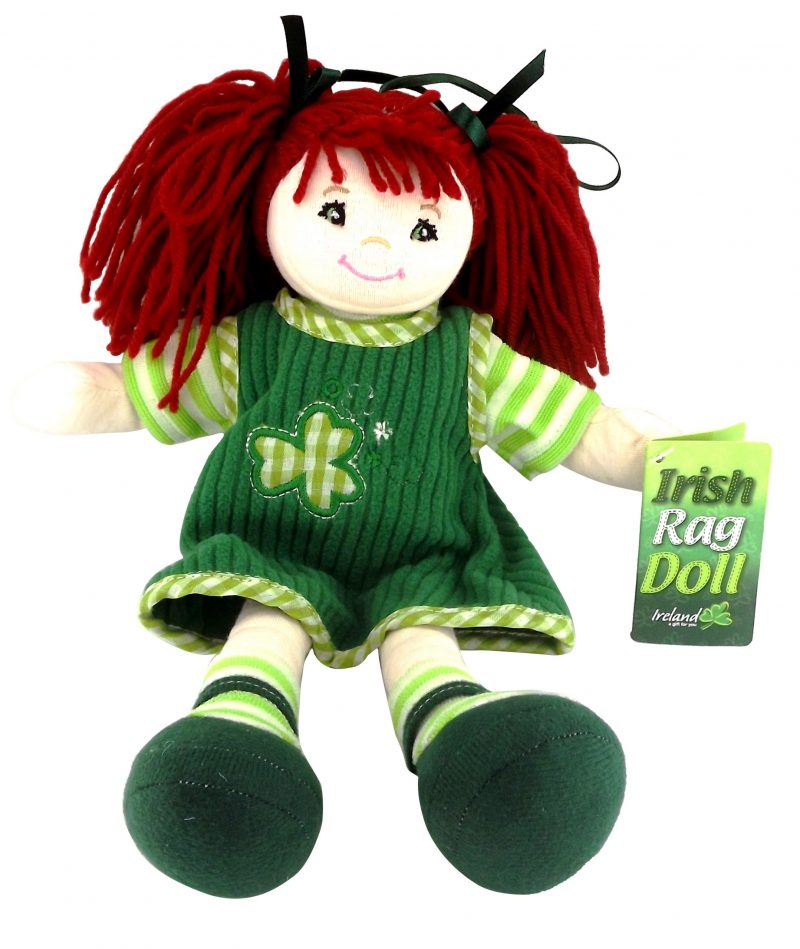 A doll with red hair, wearing a green and white dress and green and white striped shoes, with a tag showing the name 'Eileen'.