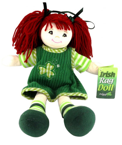A doll with red hair, wearing a green and white dress and green and white striped shoes, with a tag showing the name 'Eileen'.