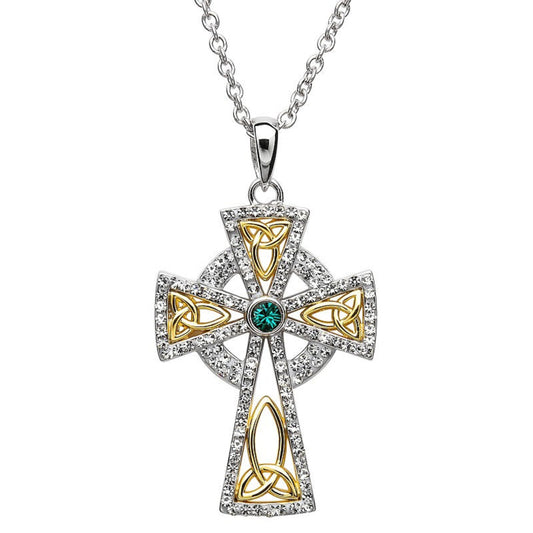 A gold plated sterling silver cross pendant embellished with white crystals and a central emerald crystal, on a silver chain.