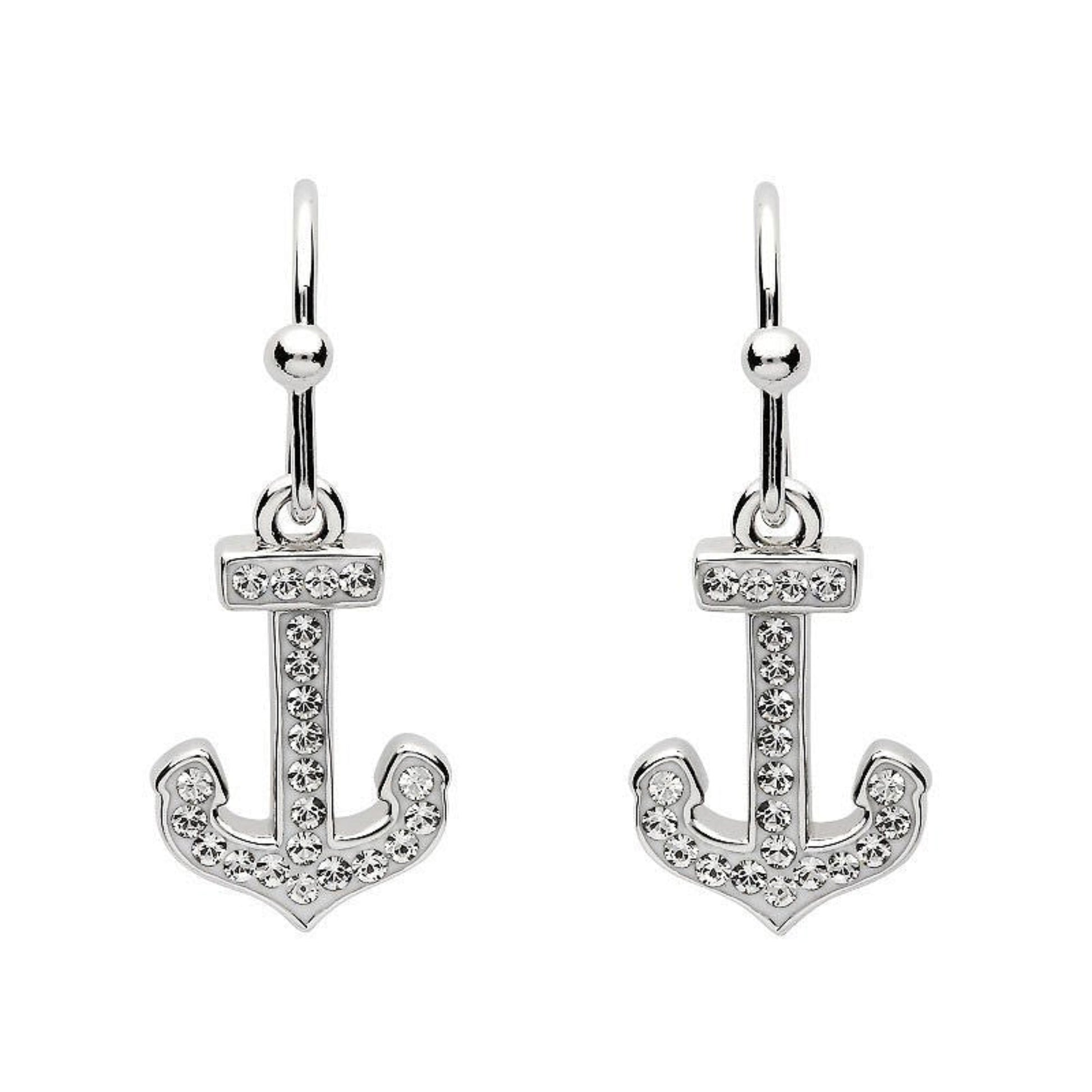 Silver anchor-shaped earrings with clear stones on a white background