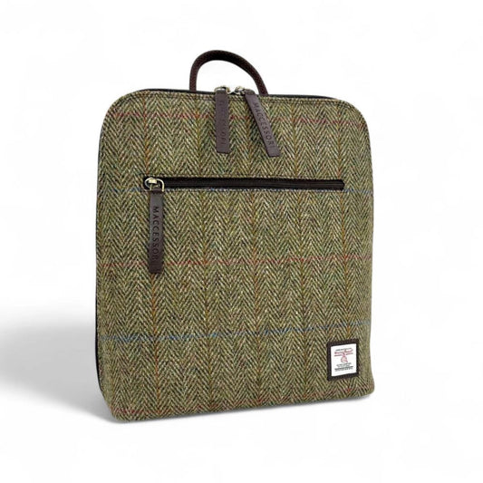 Green herringbone patterned backpack with a zipper on a white background