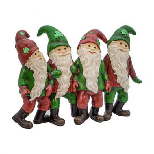 Figurine of four elves with long white beards wearing red and green clothing