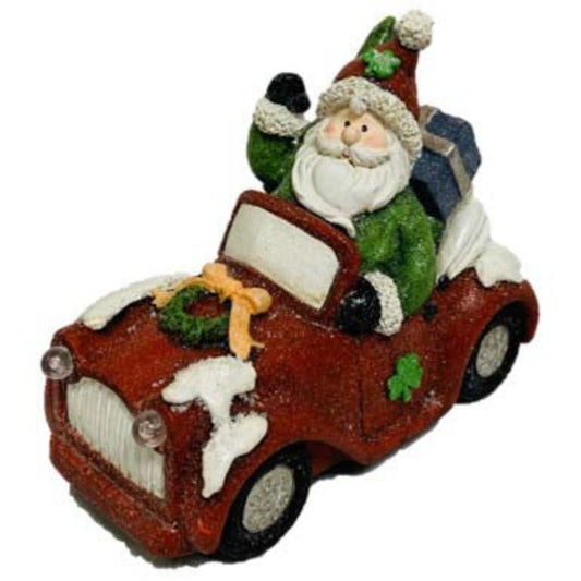 Irish Santa Claus sitting in a red frosted car with LED headlights.