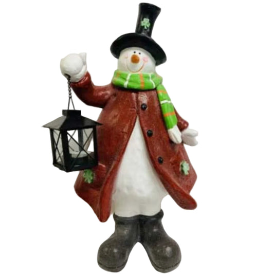 Decorative snowman figurine in a red coat holding a functional lantern