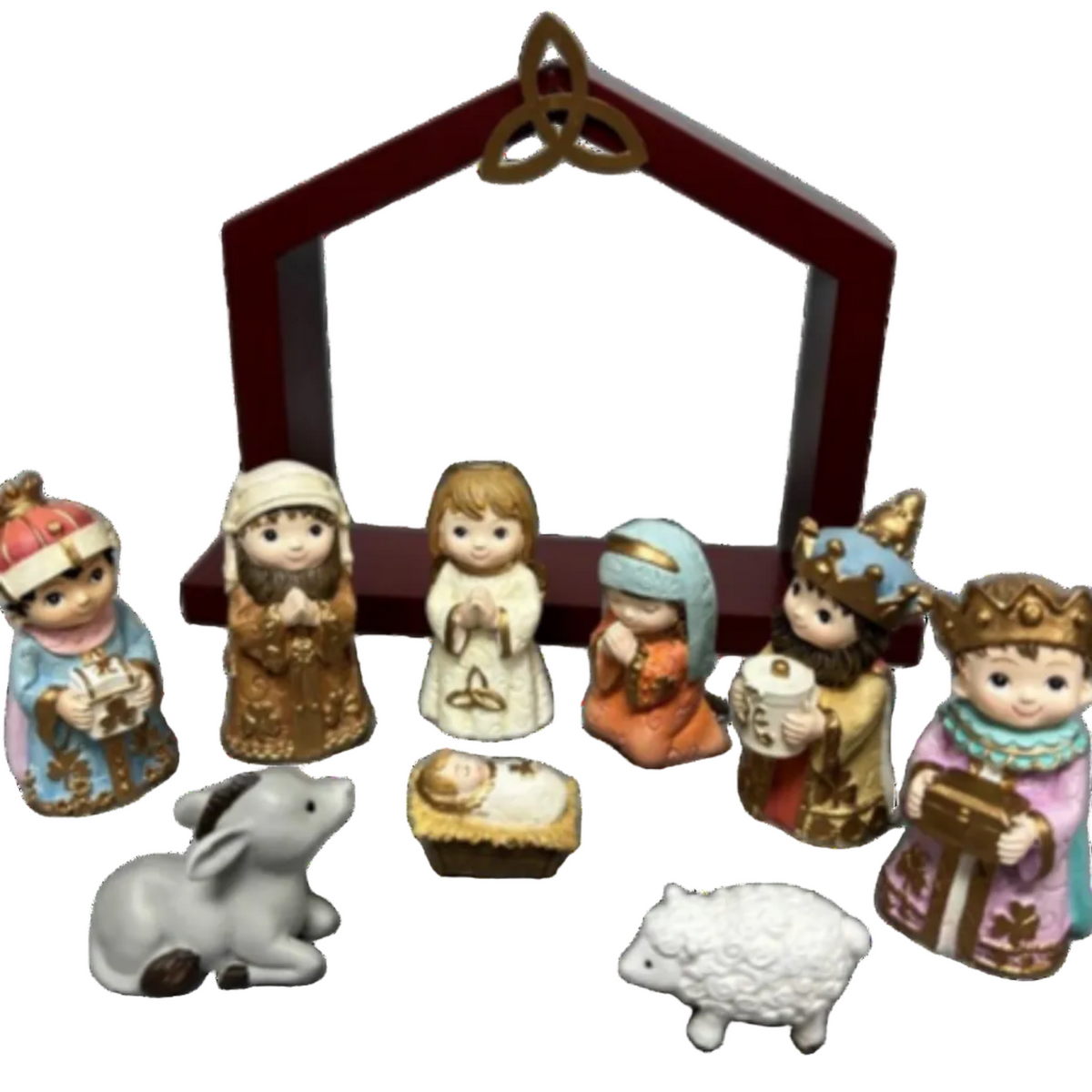 A nativity set including six human figures, one baby jesus, a donkey, a lam, and a manger frame.