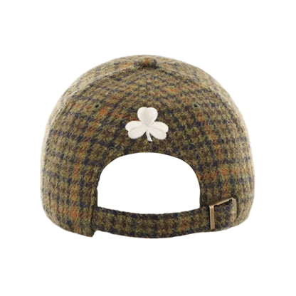 Harris Tweed cap with a shamrock design on a white background
