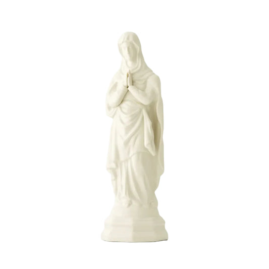 White statue of a praying figure on a white background