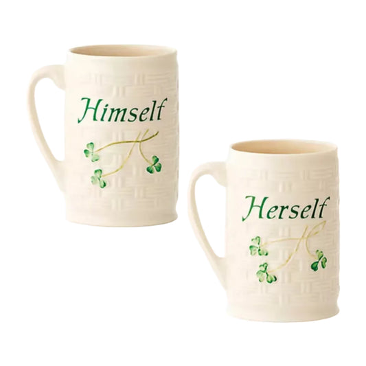 Two ceramic mugs with 'Himself' and 'Herself' text and clover designs on a white background.