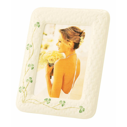Decorative photo frame with a woman holding flowers on a white background