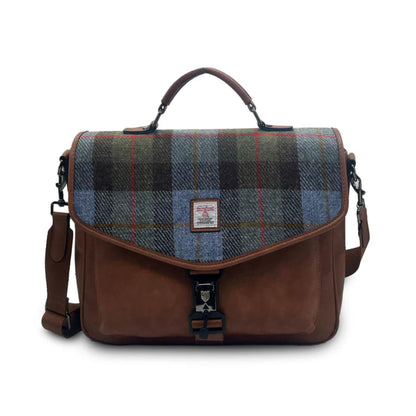 Plaid bag with brown leather accents on a white background