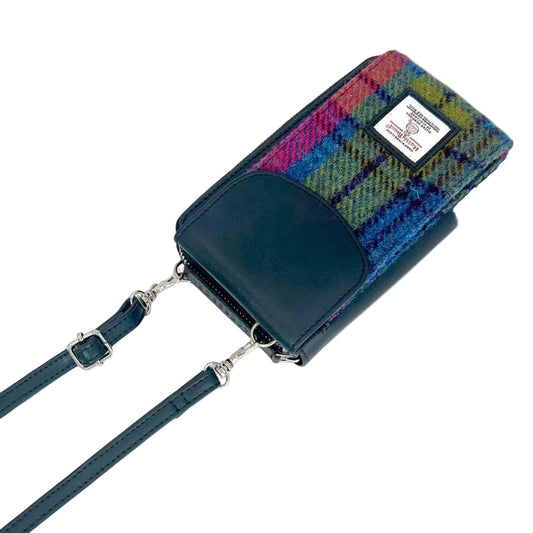 Multicolored plaid bag with a dark blue strap on a white background
