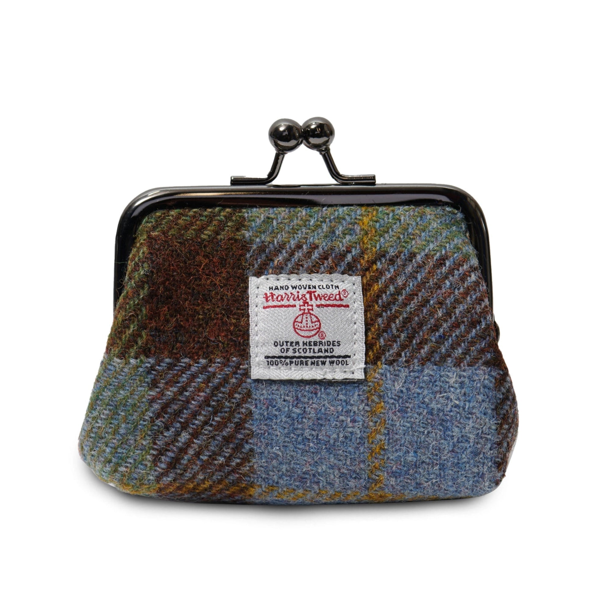 A collection of Harris Tweed coin purses with metal snap closures in various colors.