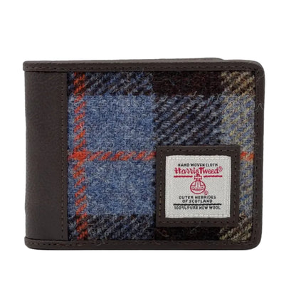 A bifold wallet with a combination of dark blue herringbone pattern and leather, featuring the Harris Tweed label.