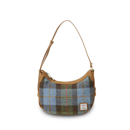 Plaid handbag with brown leather strap on a white background