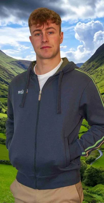 Person wearing a blue hoodie with a mountainous landscape in the background