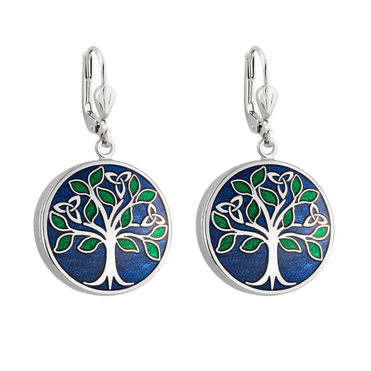 A pair of silver-colored round earrings with blue enamel. Each one depicts a tree with green leaves and trinity knots. 