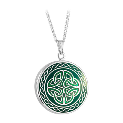A silver-colored necklace with a round green enamel pendant. Has a celtic knot design.