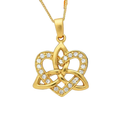 Golden pendant with an interlocking heart and trinity knot on a chain necklace.
