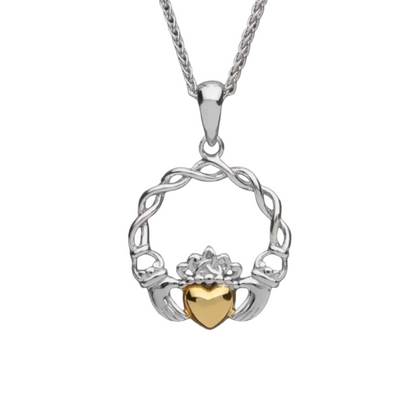 A silver claddagh pendant with a weave design and a solid gold heart in the center.