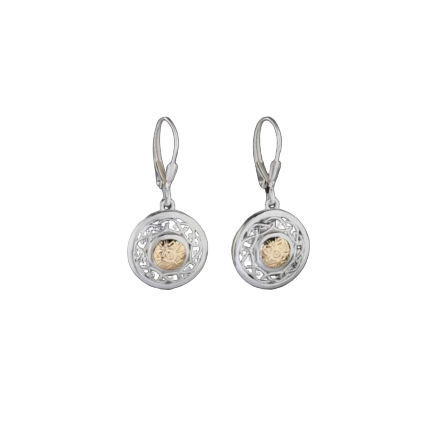 A pair of intricately carved, shield-shaped silver drop earrings with gold beads in the center.