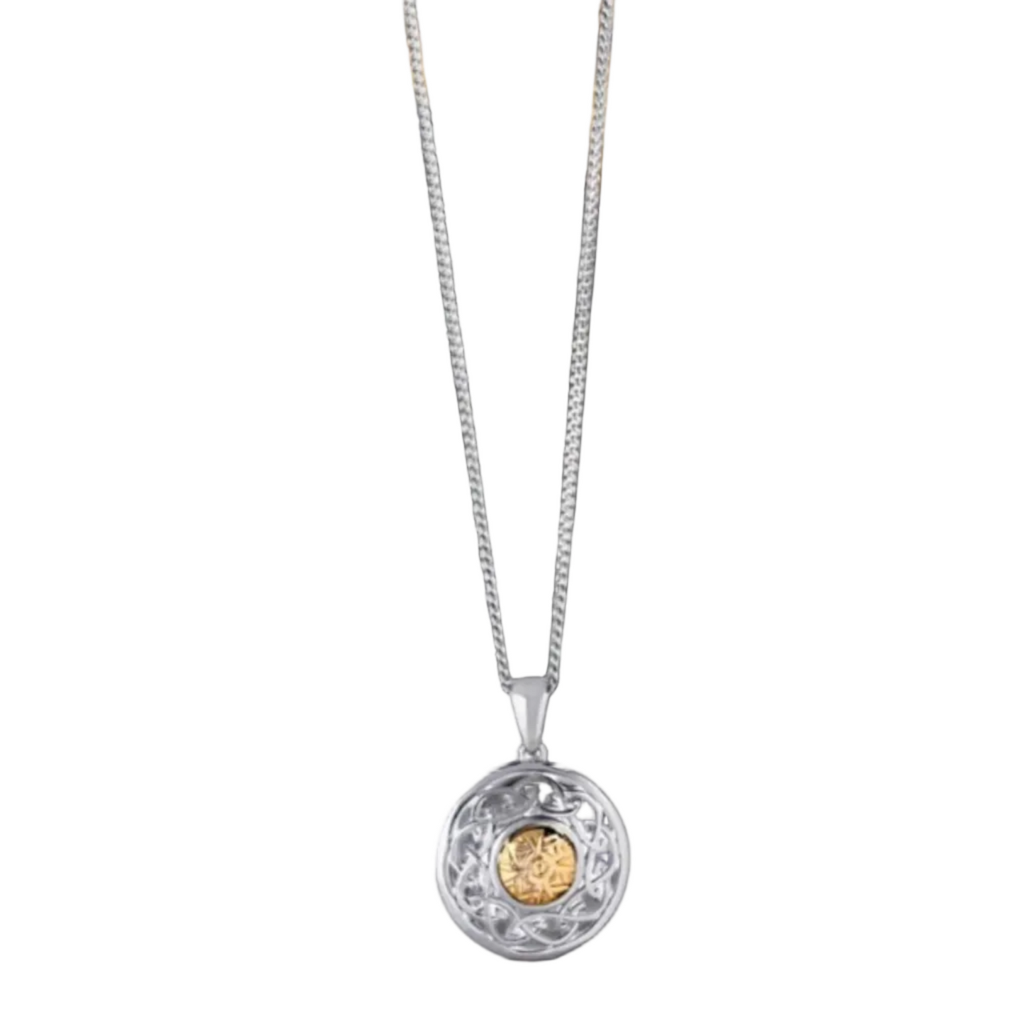 A silver necklace with a round, shield-shaped pendant. The pendant is intricately carved and has a gold bead in the center.