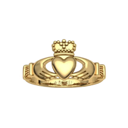 A golden claddagh ring in the traditional style with two hands holding a crowned heart.