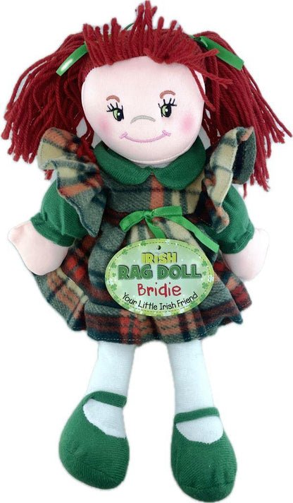 Plush doll with red hair and green dress on a white background