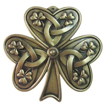 Bronze four-leaf clover with intricate designs on a white background