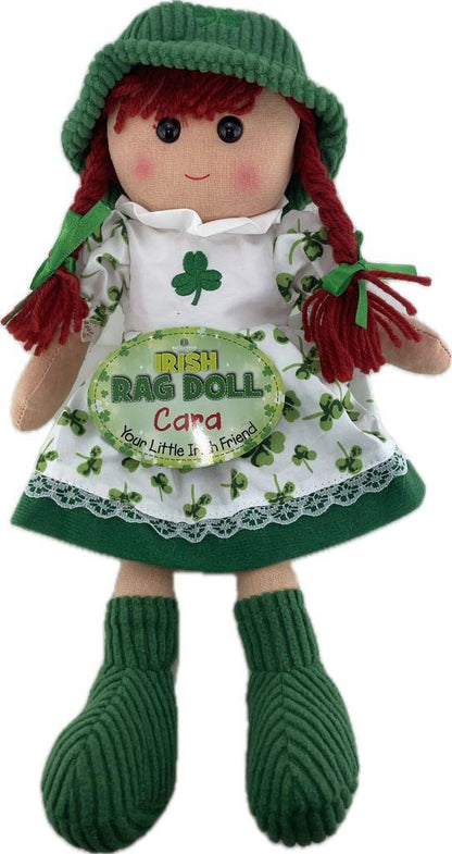 Irish rag doll with green hat, red hair, and white apron with shamrock design on a white background