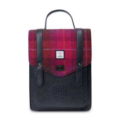 Backpack with plaid pattern on top and black leather sides on a white background